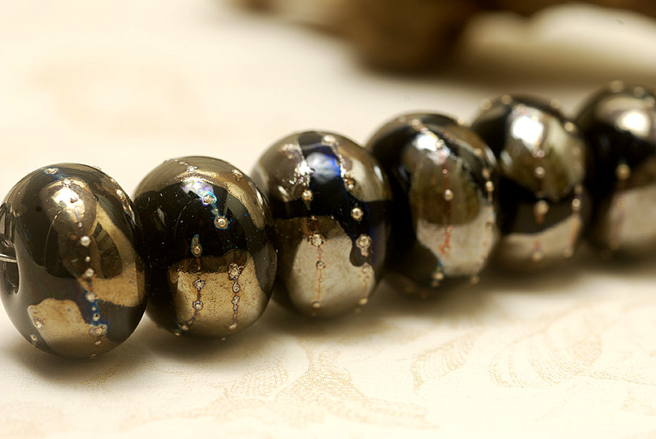10204101 - Seven Elegant Black Metallic Rondelle Beads
