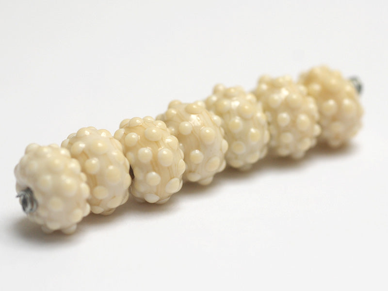 10306101 - Seven Cream Rondelle Beads
