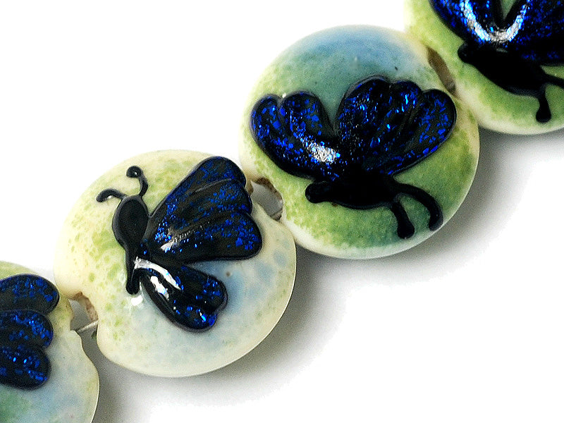 10412912 - Four Blue Sparkle Garden Butterfly Lentil Beads