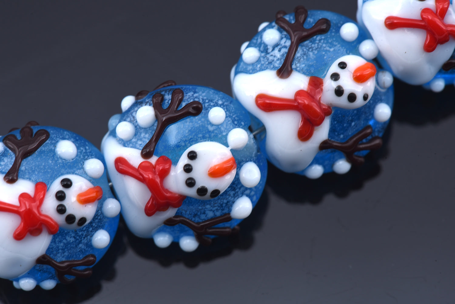 10414912- Four Juggling Snowman Lentil Beads