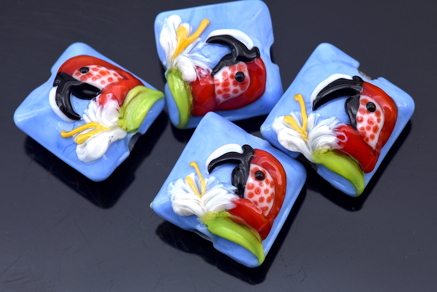 10415214 - Four Red Parrot Pillow Beads