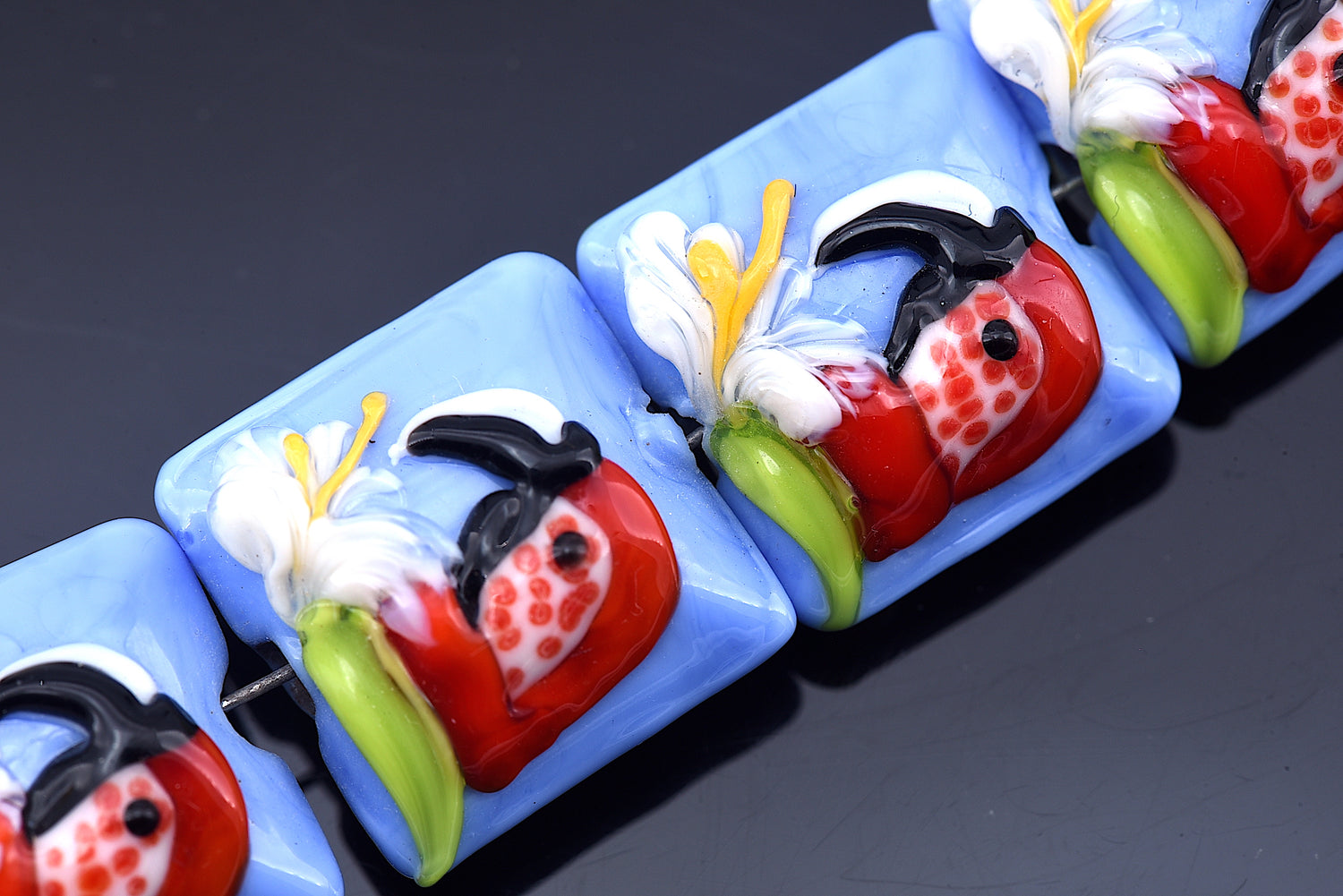 10415214 - Four Red Parrot Pillow Beads
