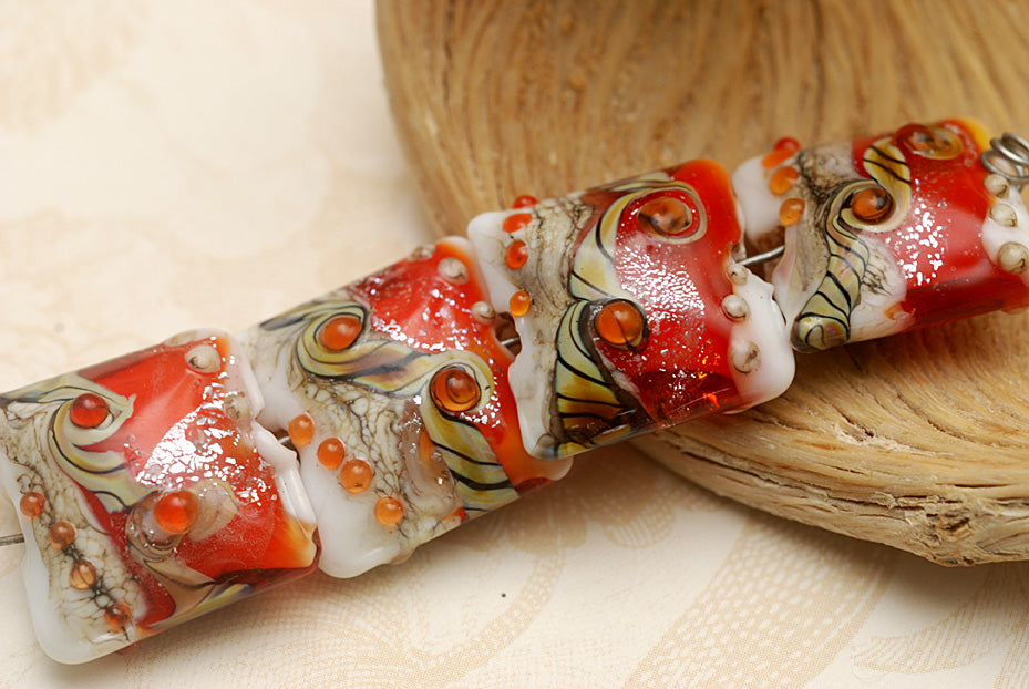 10705614 - Four Fire Red Stardust Pillow Beads