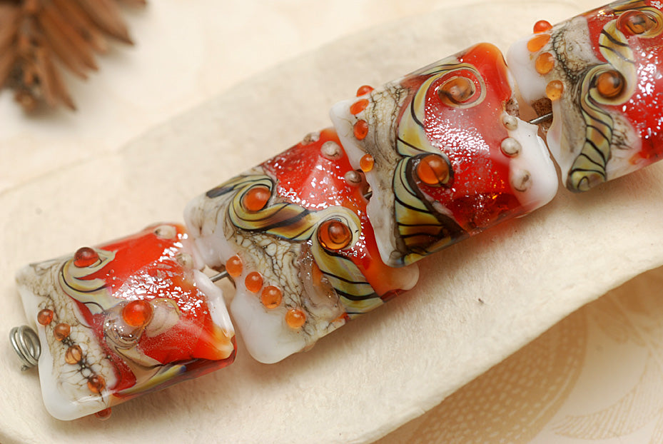 10705614 - Four Fire Red Stardust Pillow Beads