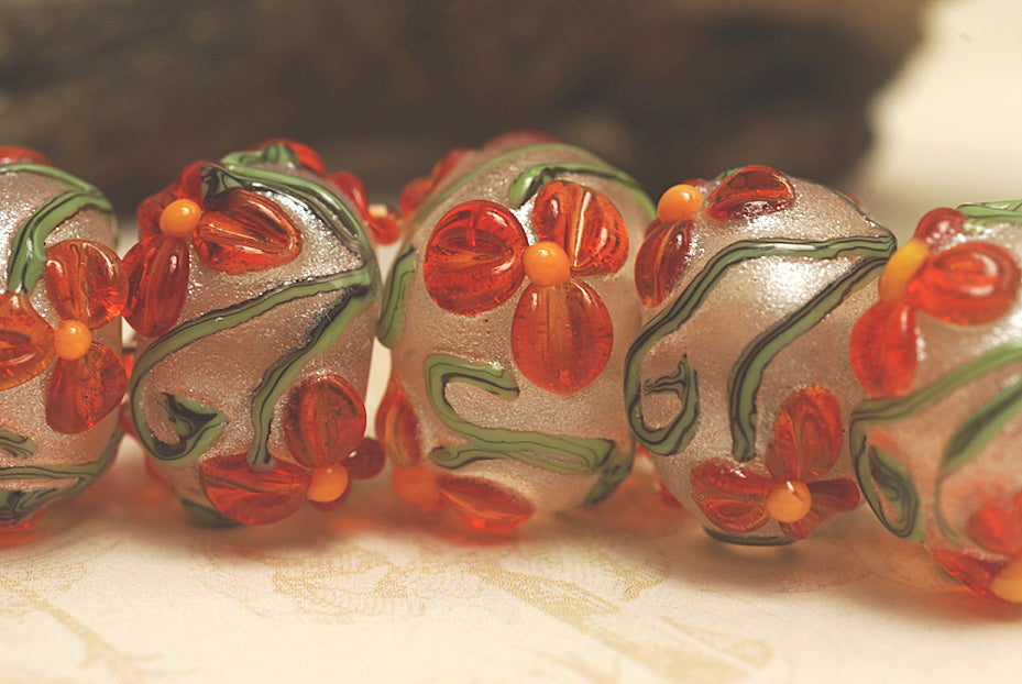 10705901 - Seven Vermilion Flower Rondelle Beads