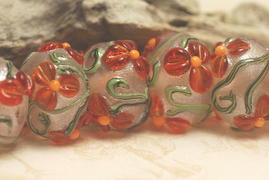 10705901 - Seven Vermilion Flower Rondelle Beads