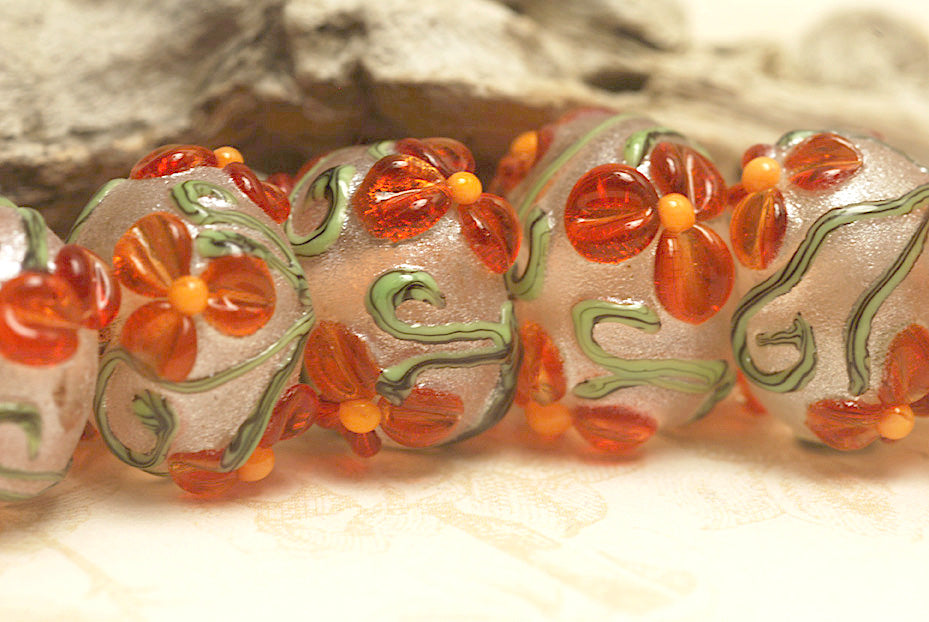 10705901 - Seven Vermilion Flower Rondelle Beads