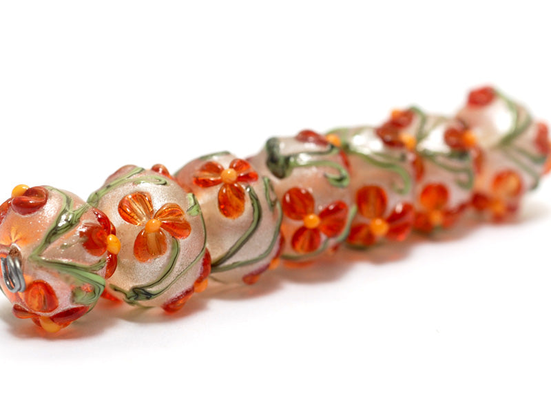10705901 - Seven Vermilion Flower Rondelle Beads
