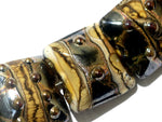 10800804 - Seven Black w/Yellow Silver Foil Pillow Beads