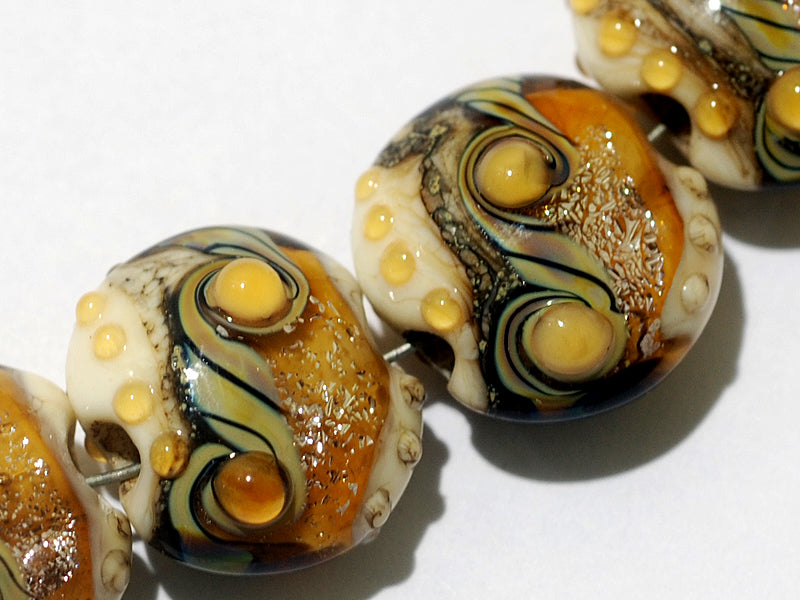 10801712 - Four Butterscotch Stardust Lentil Beads