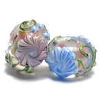 11005401 - Seven Light Pink w/Blue Floral Rondelle Beads