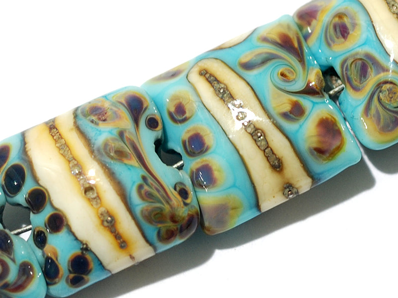 11105104 - Seven Turquoise/Ivory & Beige Pillow Beads