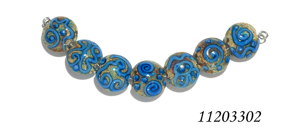 11203302 - Seven Ivory w/Blue Swirl Lentil Beads