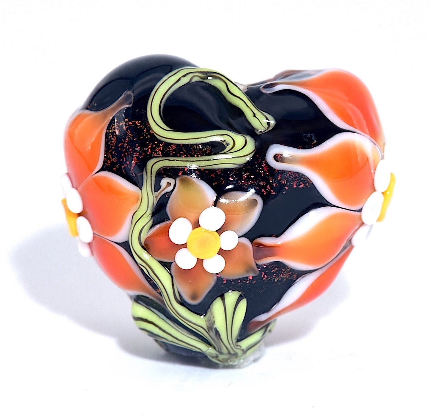 Colorful glass bead with floral design on a white background