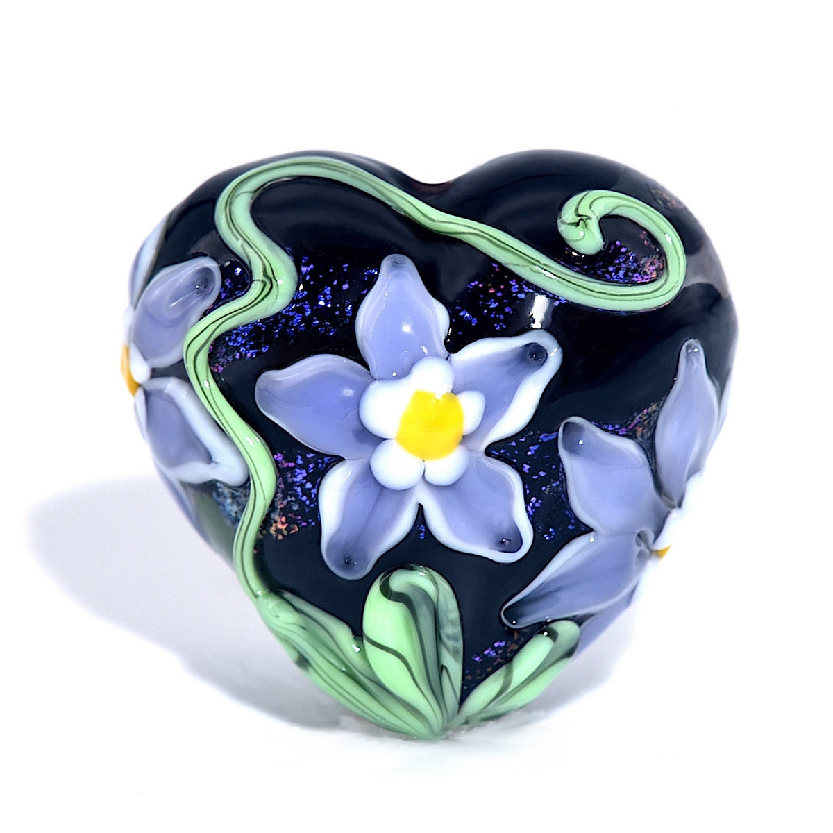 Heart-shaped object with floral design on a white background