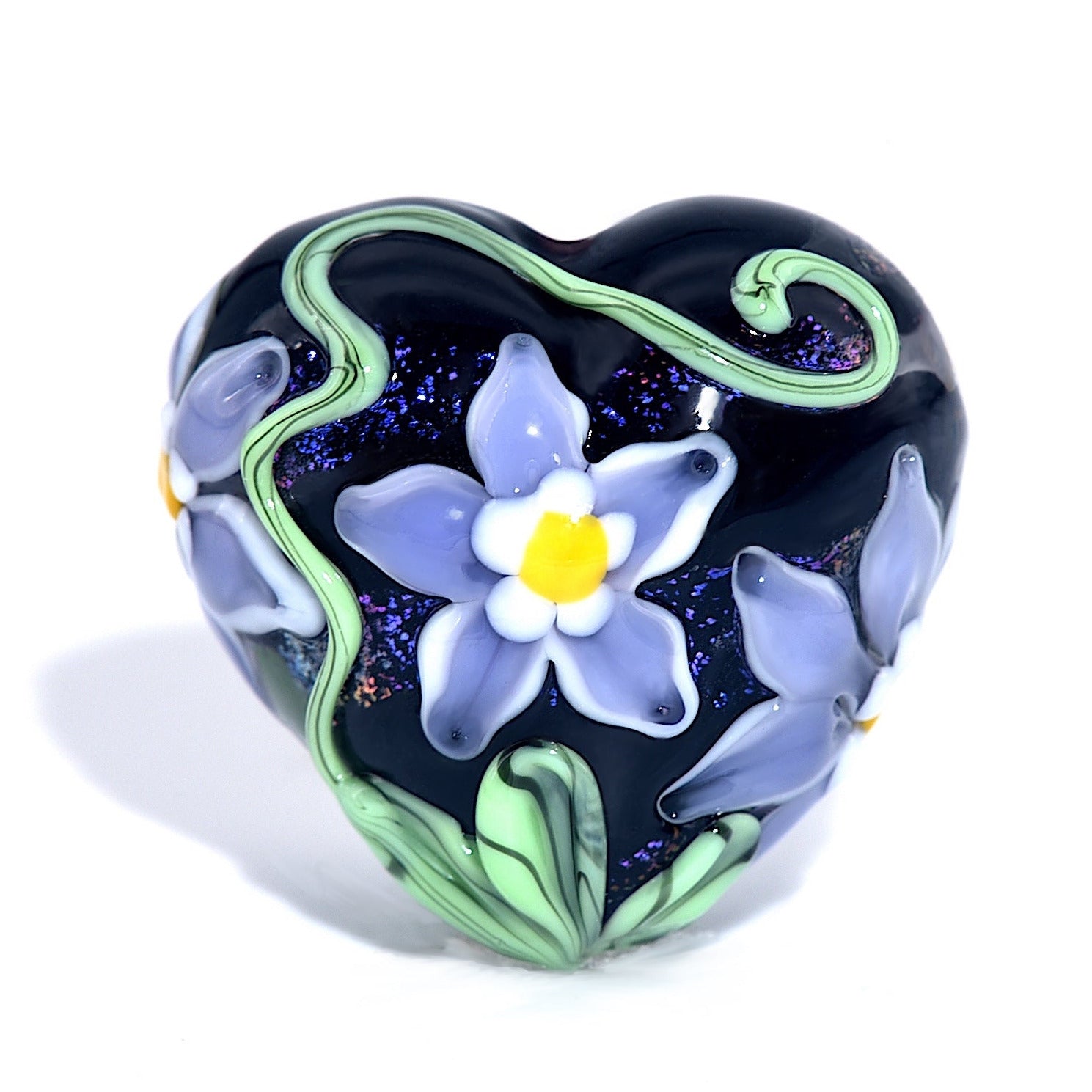 Heart-shaped object with floral design on a white background