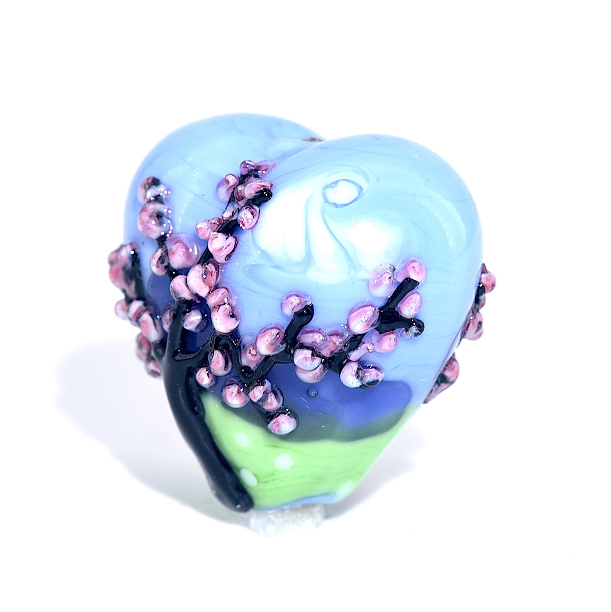 Heart-shaped object with floral design on a white background