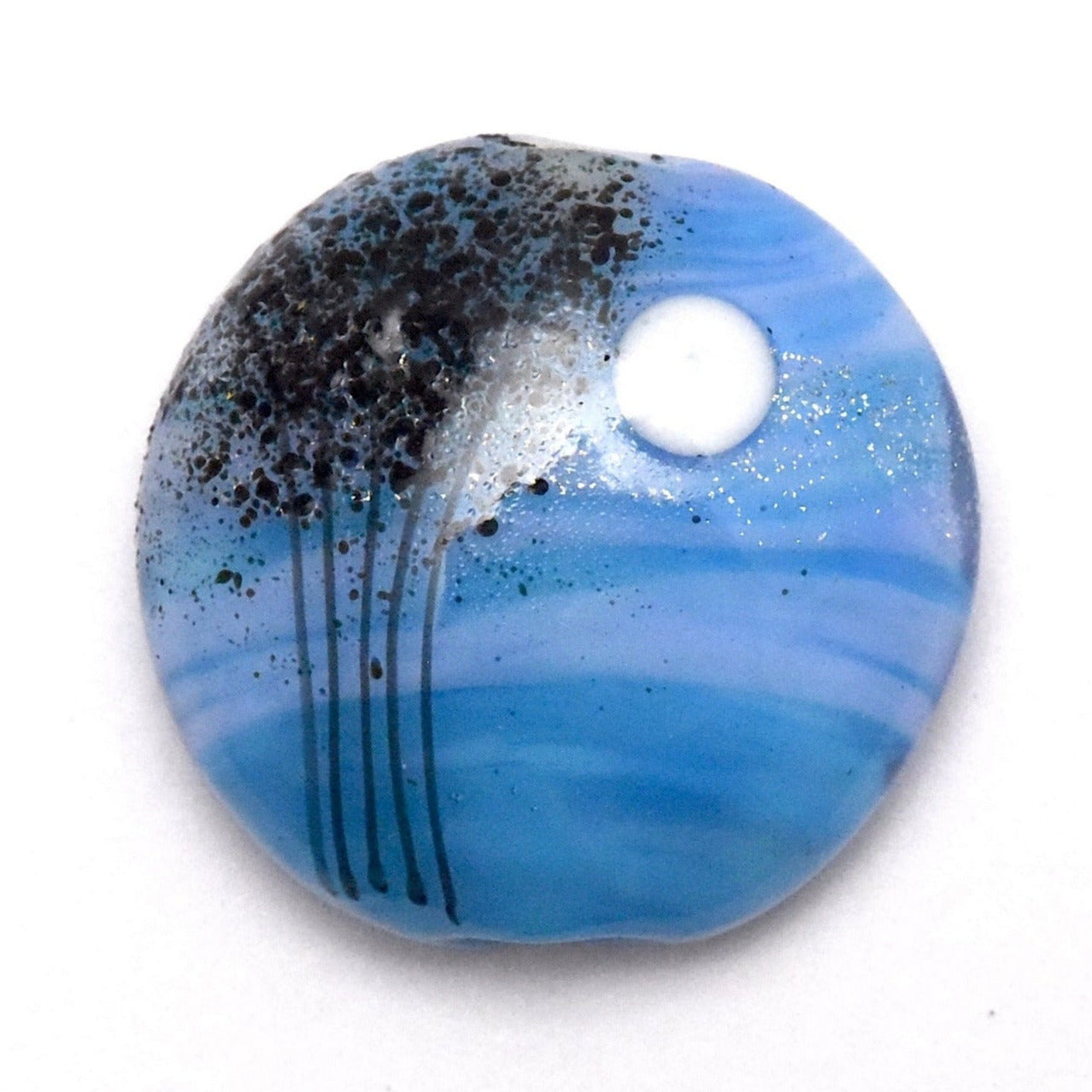 Round blue and black decorative item on a white background