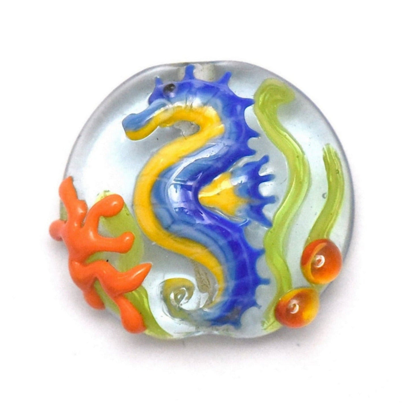 Colorful glass bead with a seahorse design on a white background