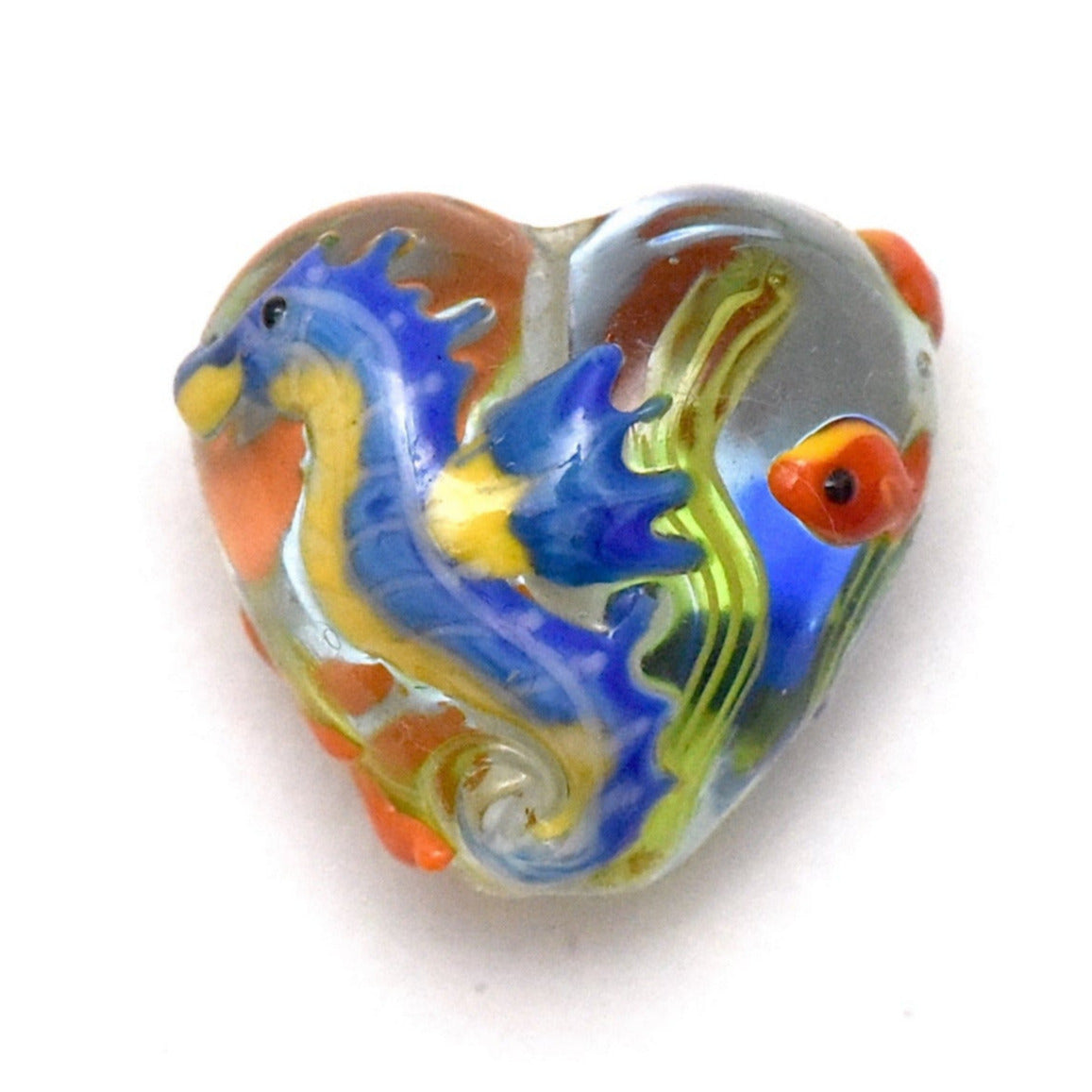 Heart-shaped glass pendant with a colorful dragon design on a white background