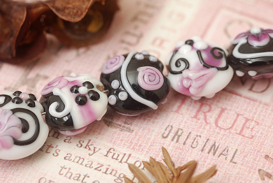 10107102 - Seven Black & White w/Pink Lentil Beads