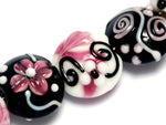 10107102 - Seven Black & White w/Pink Lentil Beads