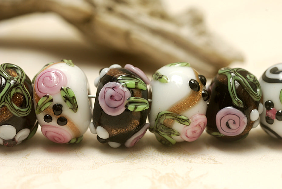 10107501 - Seven Black/White w/Flower & Leaf Rondelle Beads