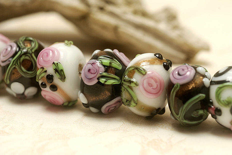 10107501 - Seven Black/White w/Flower & Leaf Rondelle Beads