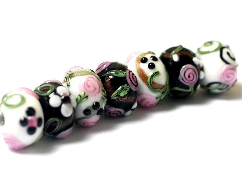 10107501 - Seven Black/White w/Flower & Leaf Rondelle Beads
