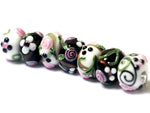 10107501 - Seven Black/White w/Flower & Leaf Rondelle Beads
