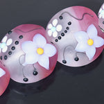 Decorative items with floral designs on a dark background