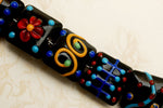 10201204 - Seven Black Based Fiesta Lentil Beads