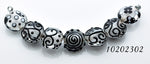 10202302 - Seven Black & White Lentil Beads