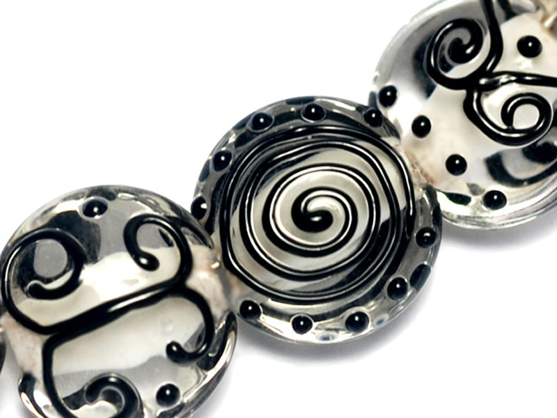 10202302 - Seven Black & White Lentil Beads
