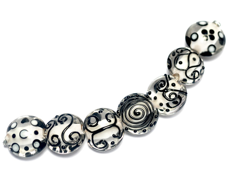 10202302 - Seven Black & White Lentil Beads