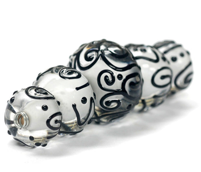 10202311 - Five Graduated Black & White Rondelle Beads
