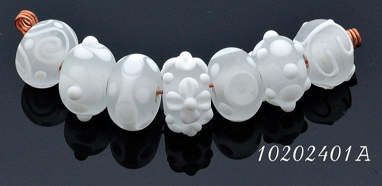 10204001 - Seven Matte Finish White Rondelle Beads