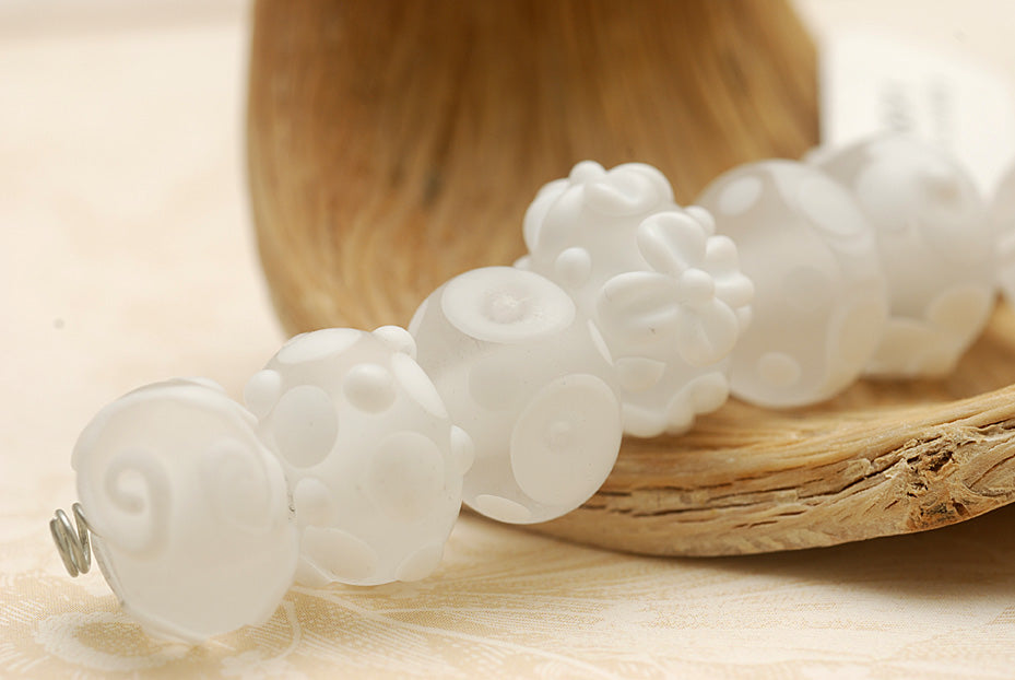 10204001 - Seven Matte Finish White Rondelle Beads