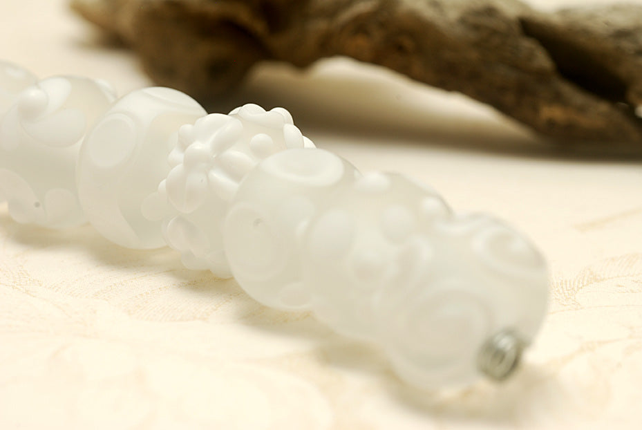 10204001 - Seven Matte Finish White Rondelle Beads