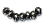 10204101 - Seven Elegant Black Metallic Rondelle Beads