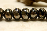 10204101 - Seven Elegant Black Metallic Rondelle Beads