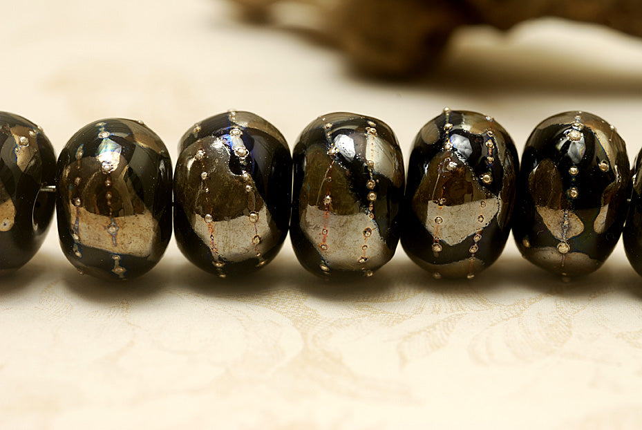 10204101 - Seven Elegant Black Metallic Rondelle Beads