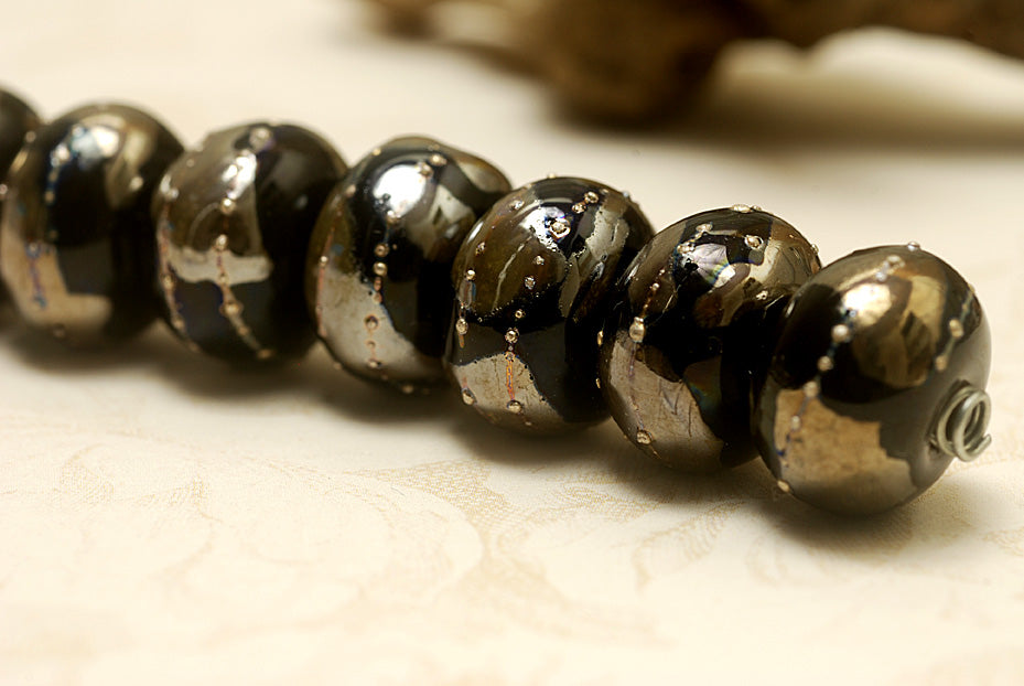 10204101 - Seven Elegant Black Metallic Rondelle Beads