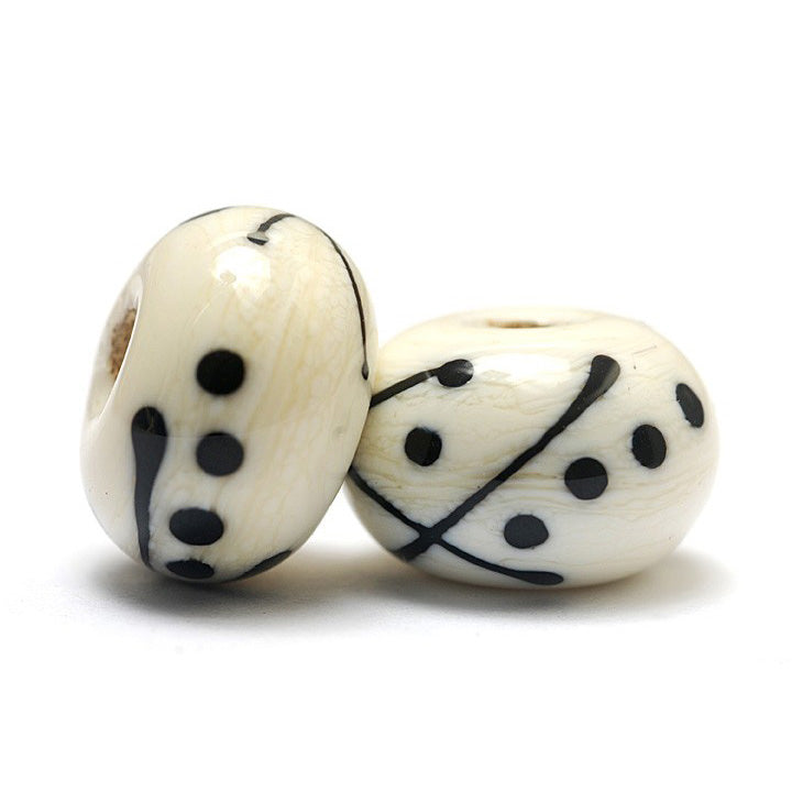 10303001 - Seven Ivory w/Black Rondelle Beads