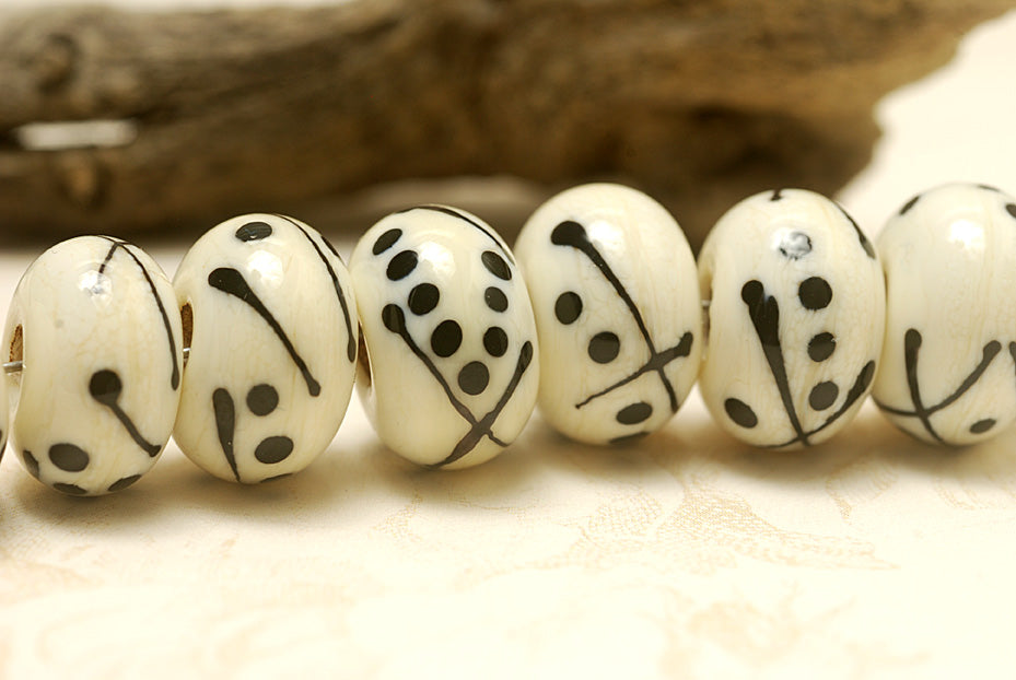 10303001 - Seven Ivory w/Black Rondelle Beads