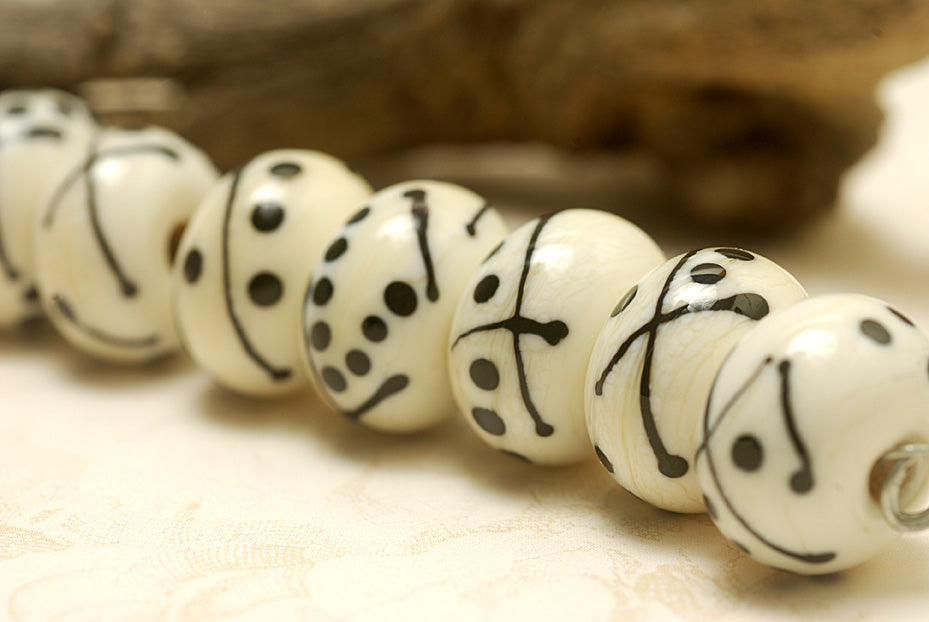 10303001 - Seven Ivory w/Black Rondelle Beads