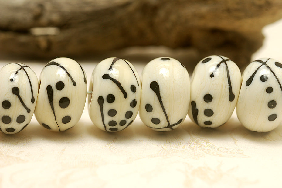 10303001 - Seven Ivory w/Black Rondelle Beads