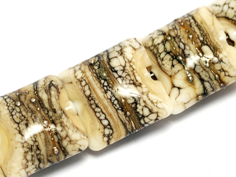 10306004 - Seven Dark Ivory w/Silver Pillow Beads