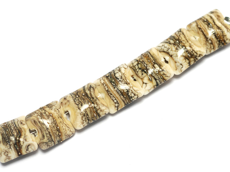 10306004 - Seven Dark Ivory w/Silver Pillow Beads