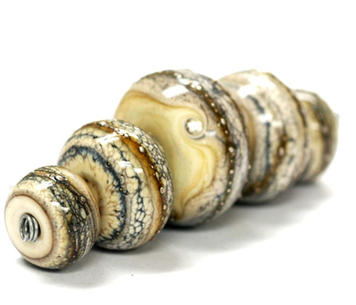 10306011 - Five Graduated Dark Ivory w/Silver Rondelle Beads